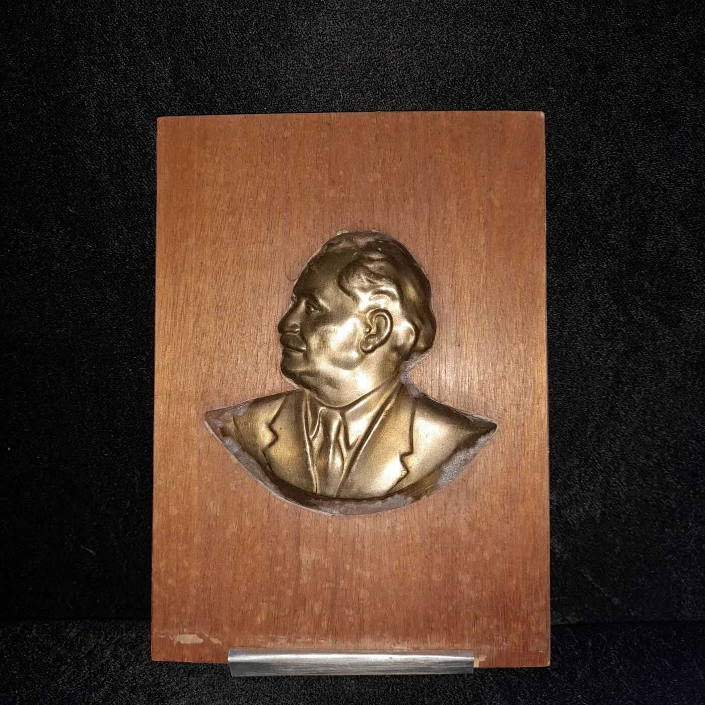 Small brass bust of Georgi Dimitrov on a wooden board
