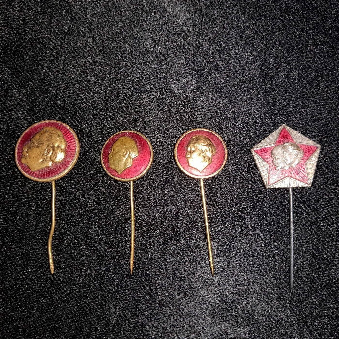 Small pins bearing the likeness of Georgi Dimitrov