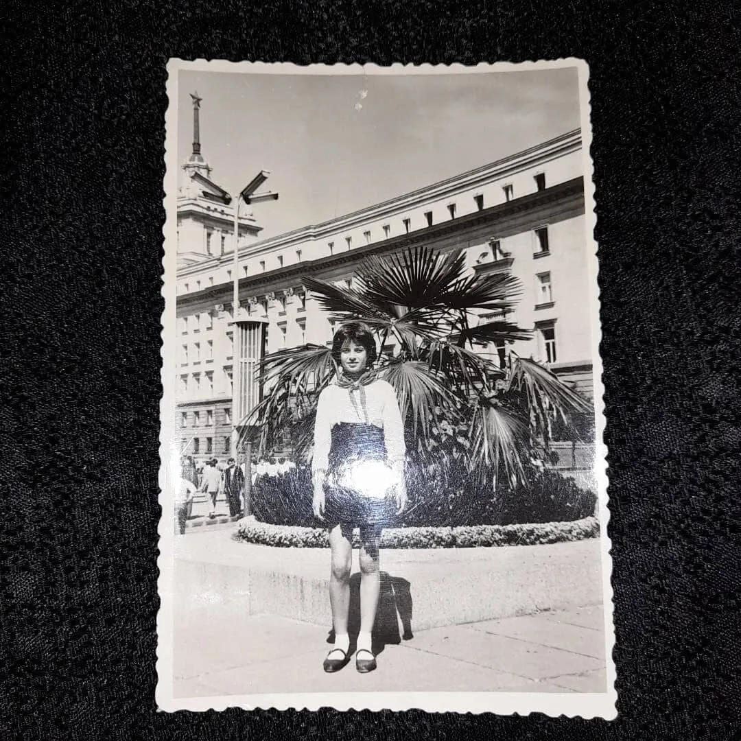 Schoolgirl posing in front of the Party House building in Sofia