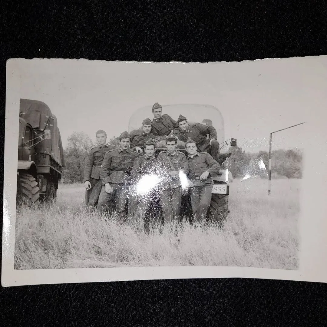 A squad in winter uniform in front of their truck