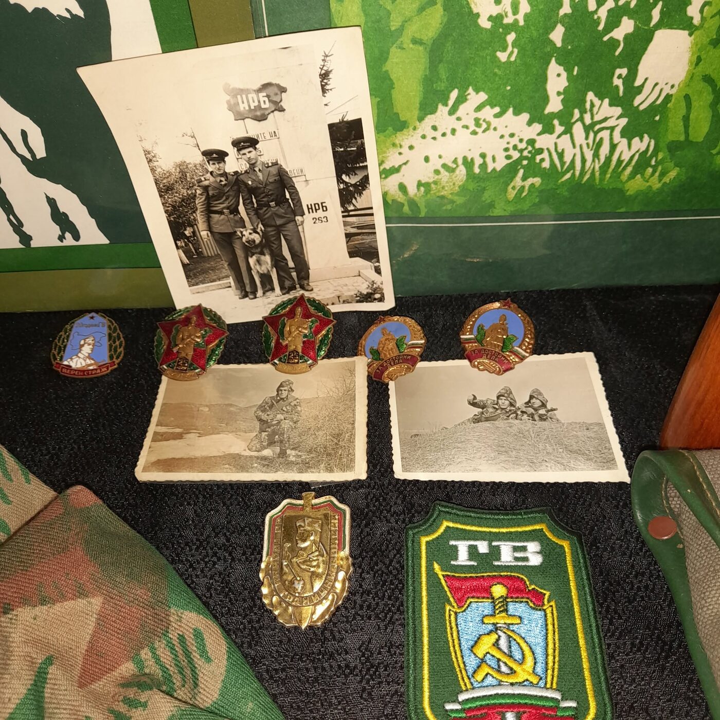 Border Troops insignia, sleeve patch, and photograph of two border guards with their dog before a boundary marker of the People's Republic