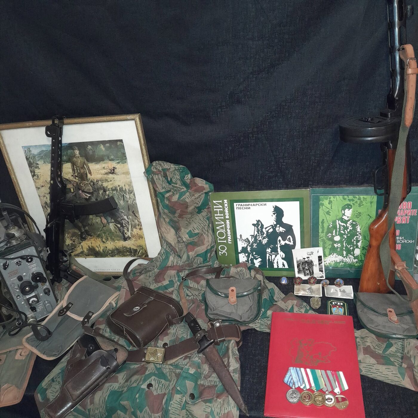 A set of objects of the Bulgarian Border Troops: camouflage uniform, field radio set, weapons, insignia, records and decorations