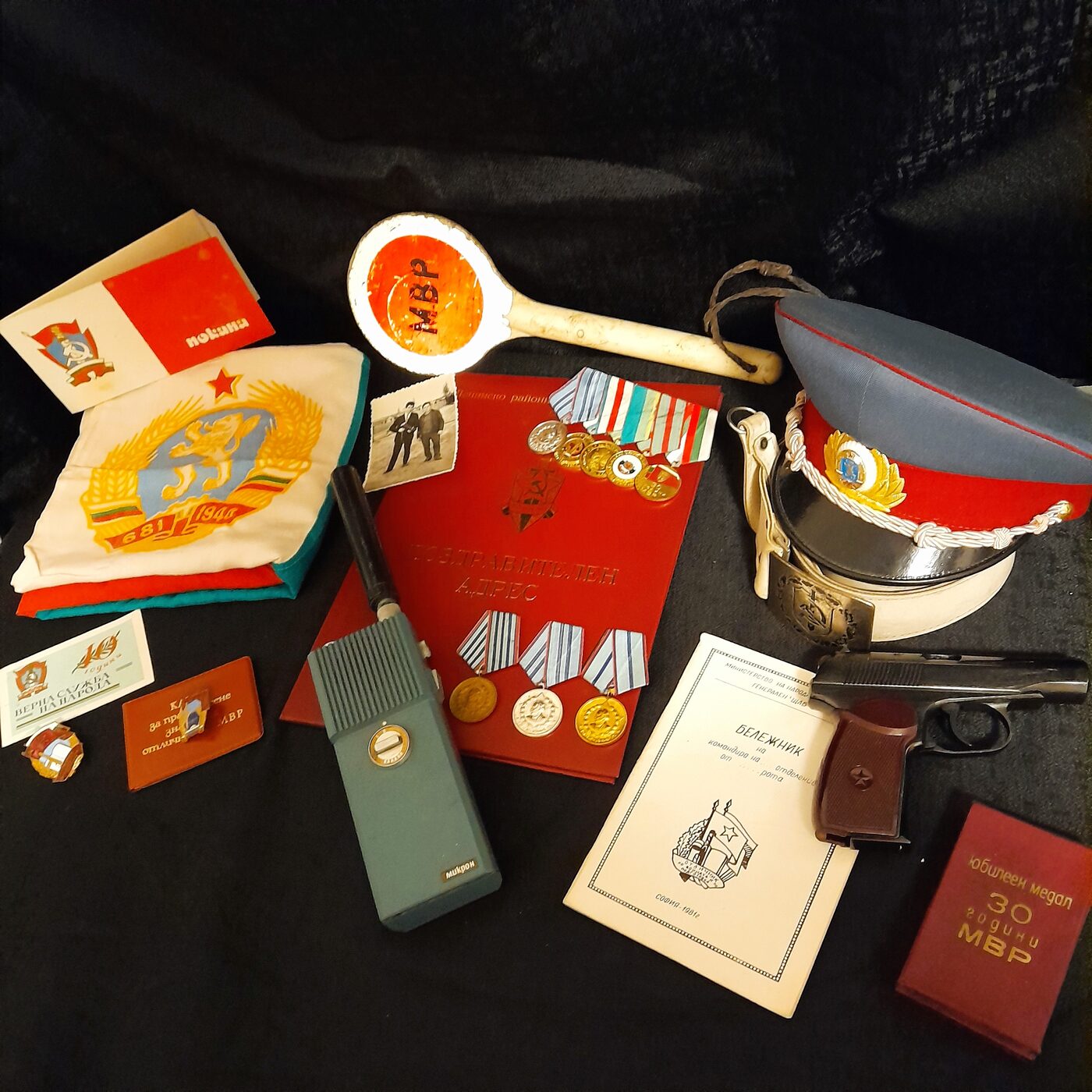 A set of Ministry of the Interior objects: People's Militia officer's cap, traffic paddle, parade belt, Makarov pistol, portable radio set and service decorations